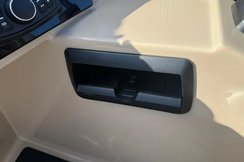 Slide: The Image of Control panel and storage compartment in 2026 Bentley Pontoons Elite 253 Admiral. - 16
