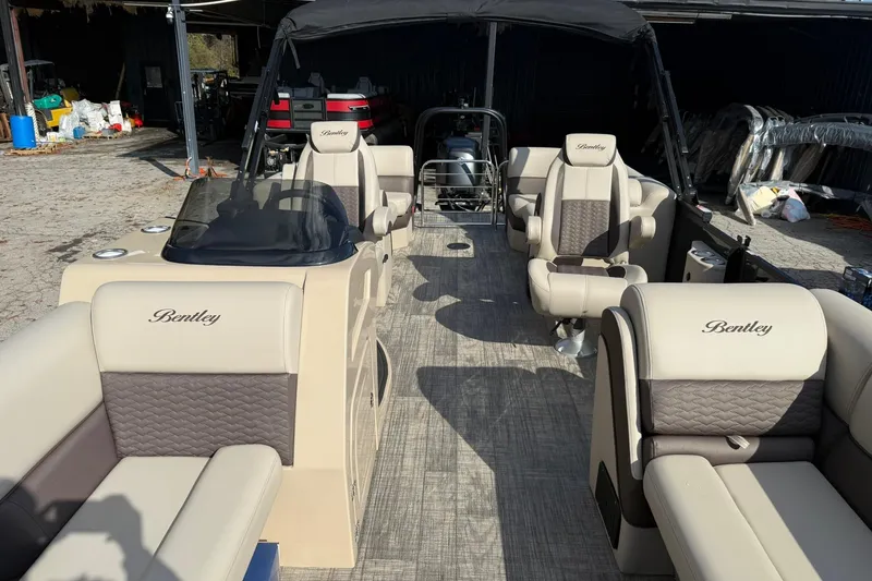 Slide: The Image of 2026 Bentley Pontoons Elite 253 Admiral interior with luxurious seating and modern design. - 18