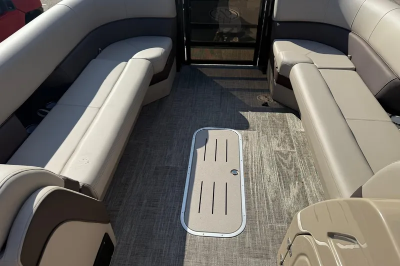 Slide: The Image of 2026 Bentley Pontoons Elite 253 Admiral interior with luxurious seating and modern flooring. - 7