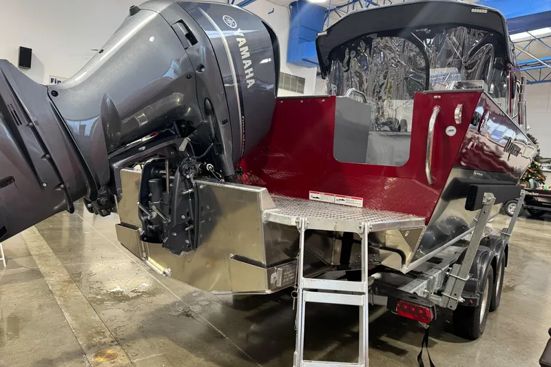 Slide: The Image of 2026 Duckworth 23 Pacific Navigator with Yamaha outboard motor in showroom. - 10