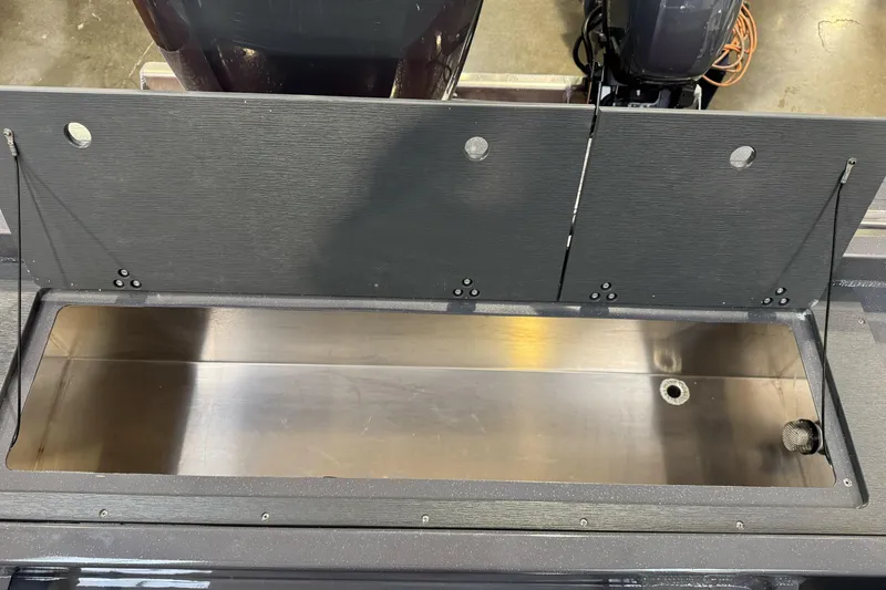 Slide: The Image of 2026 Duckworth 23 Pacific Navigator boat storage compartment, open and empty. - 15