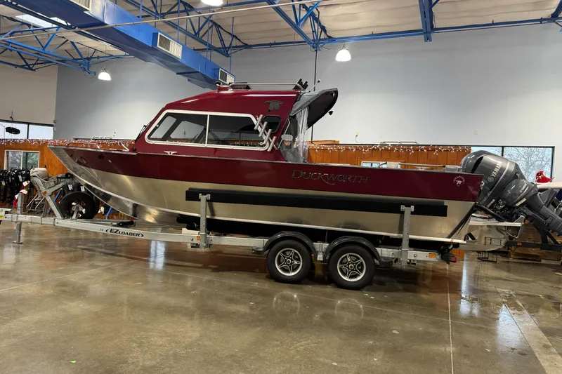 The Image of 2026 Duckworth 23 Pacific Navigator boat on trailer in showroom. - 2