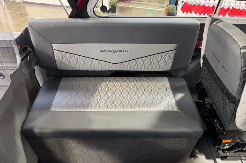 Slide: The Image of 2026 Duckworth 23 Pacific Navigator interior seating with diamond-stitched upholstery. - 24