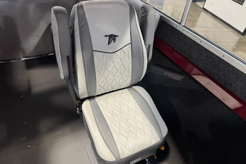 Slide: The Image of Luxury seat in 2026 Duckworth 23 Pacific Navigator boat, featuring diamond stitching and logo. - 27