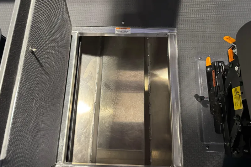 Slide: The Image of Open storage compartment in 2026 Duckworth 23 Pacific Navigator boat interior. - 28