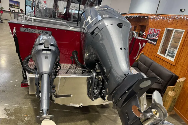 Slide: The Image of 2026 Duckworth 23 Pacific Navigator boat with dual Yamaha outboard motors in showroom. - 9