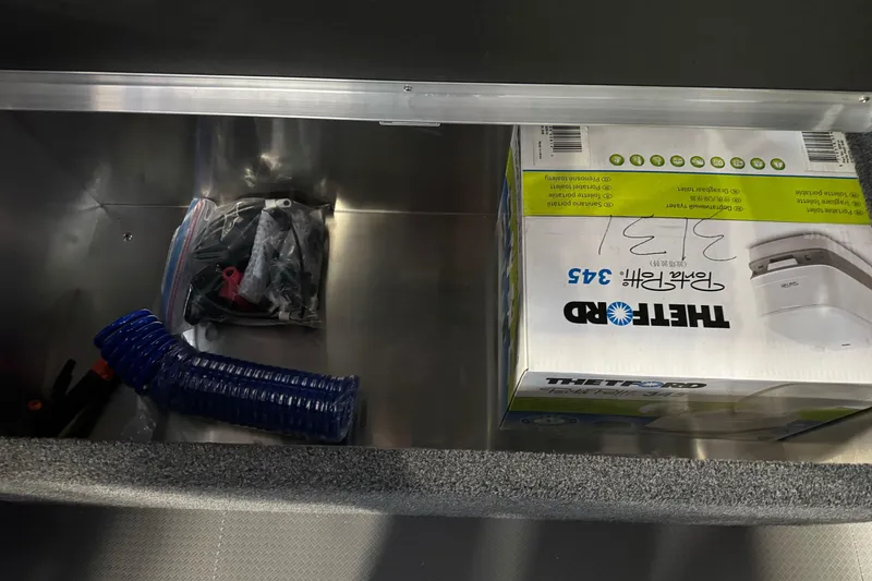 Slide: The Image of Interior storage of 2026 Duckworth 23 Pacific Navigator with Thetford box and accessories. - 20