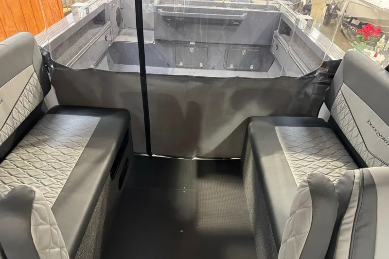 Slide: The Image of Interior of 2026 Duckworth 23 Pacific Navigator boat with quilted seating. - 23