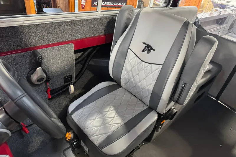 Slide: The Image of Interior of 2026 Duckworth 23 Pacific Navigator boat with gray and black seating. - 26