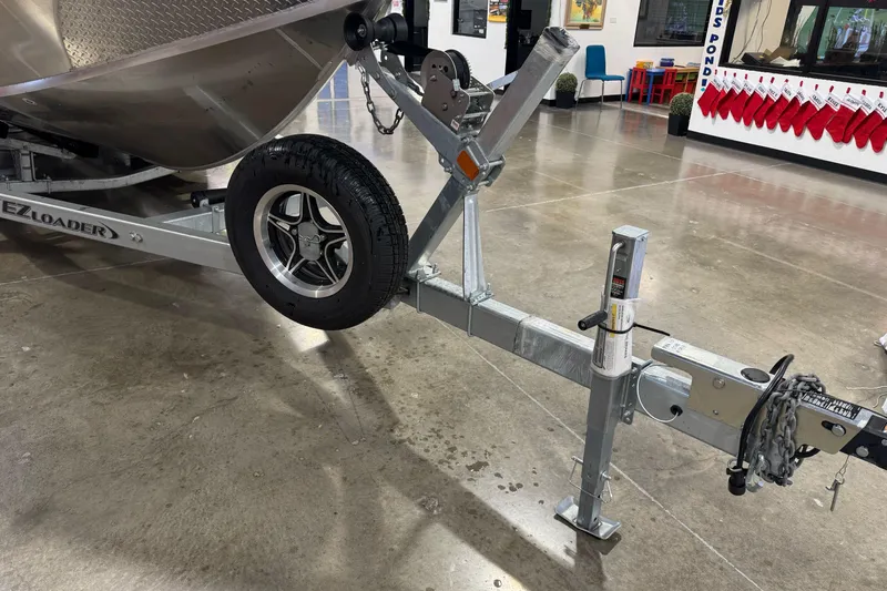 Slide: The Image of Trailer for 2026 Duckworth 23 Pacific Navigator boat in showroom. - 4