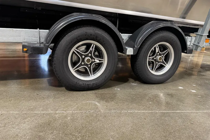 Slide: The Image of Trailer wheels of a 2026 Duckworth 23 Pacific Navigator boat. - 7