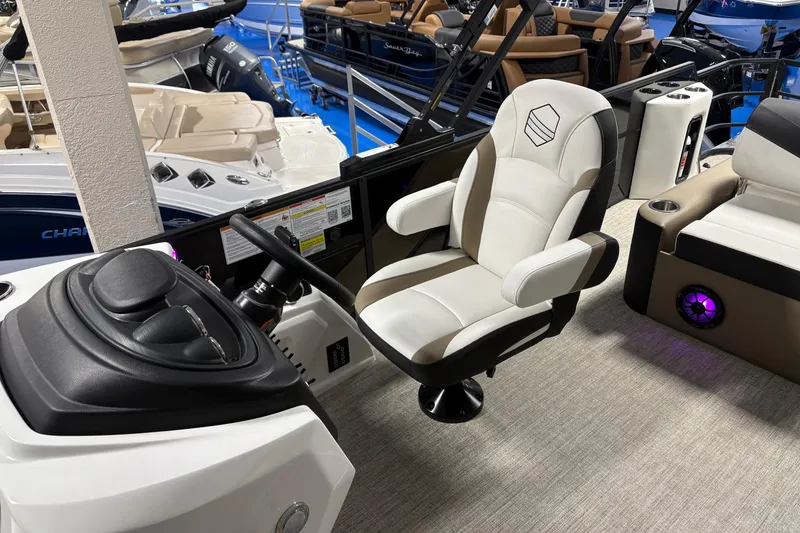 Slide: The Image of Captain's chair and helm of 2026 South Bay S224UL pontoon boat, showcasing modern design. - 7