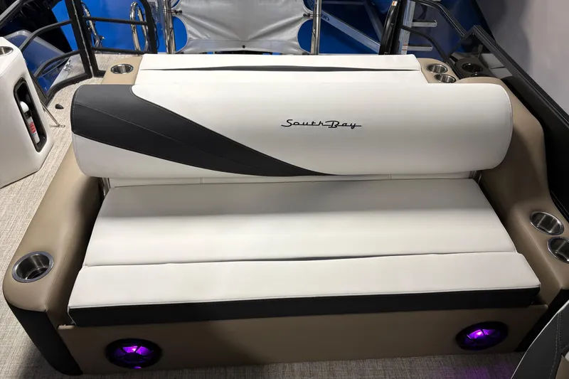 Slide: The Image of Luxurious seating on 2026 South Bay S224UL boat with cup holders and ambient lighting. - 8