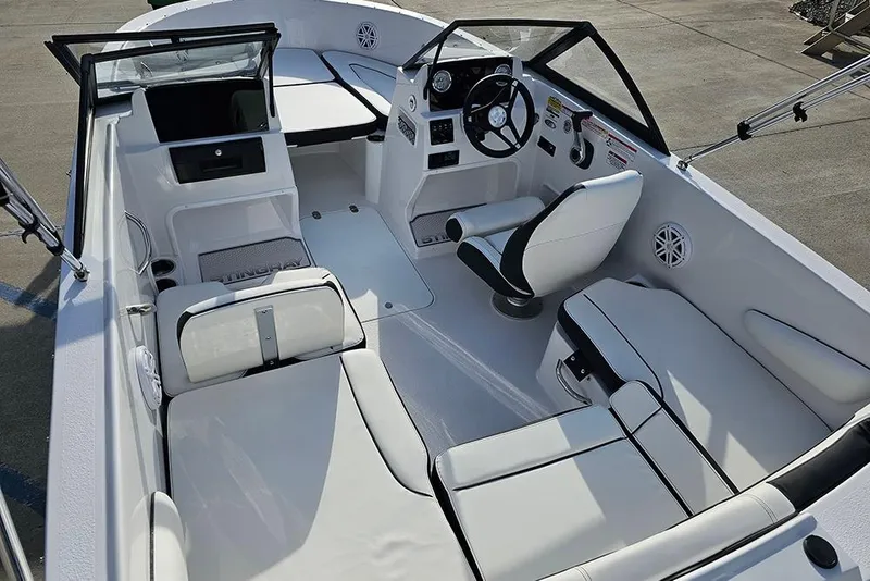 Slide: The Image of 2026 Stingray 172 DC boat interior with white seating and modern dashboard. - 10