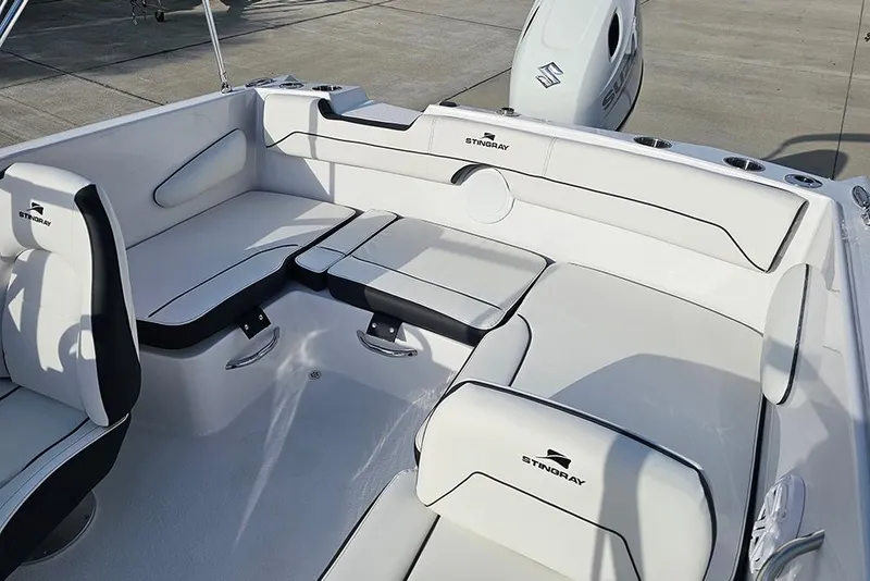 Slide: The Image of 2026 Stingray 172 DC boat interior with white seating and sleek design. - 11