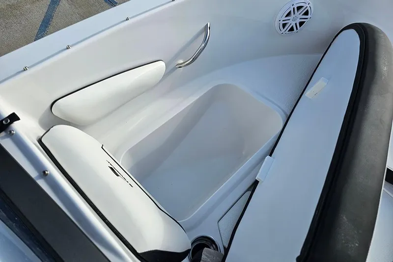 Slide: The Image of Interior of 2026 Stingray 172 DC boat, featuring white seating and storage compartment. - 22