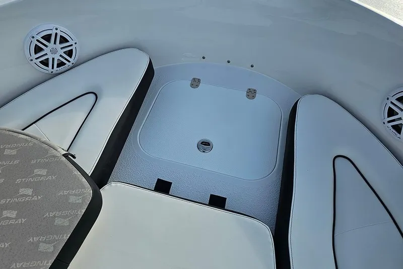Slide: The Image of Interior of 2026 Stingray 172 DC boat with cushioned seating and speaker system. - 23