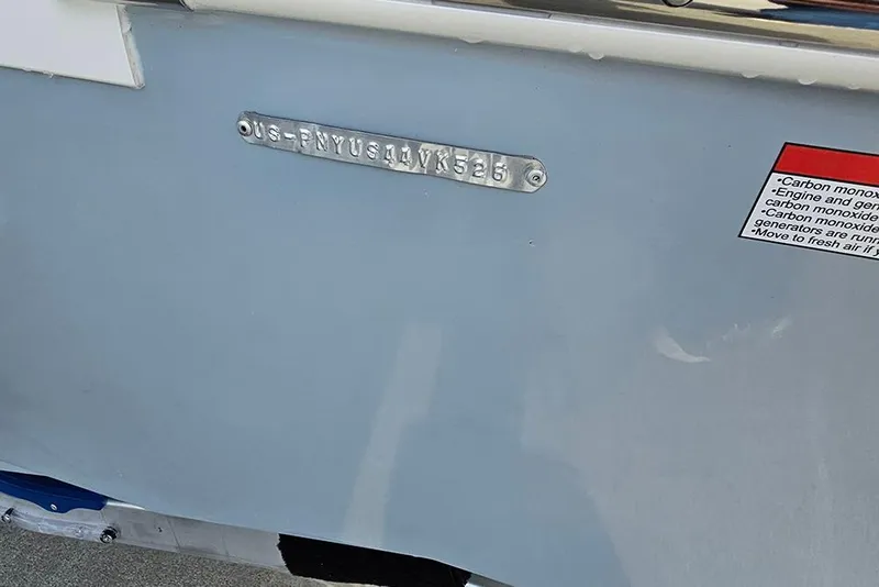 Slide: The Image of 2026 Stingray 172 DC boat hull identification number and safety warning label. - 26