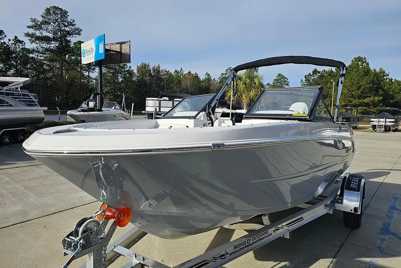 Slide: The Image of 2026 Stingray 172 DC boat on trailer in outdoor dealership setting. - 5