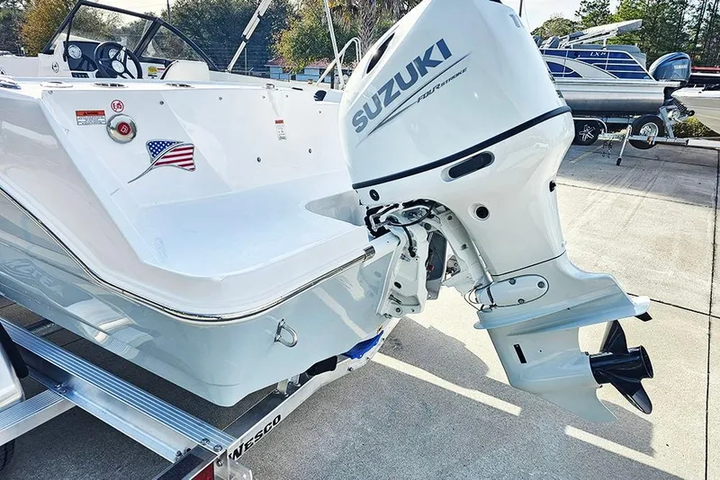 Slide: The Image of 2026 Stingray 172 DC boat with Suzuki outboard motor on a trailer. - 9