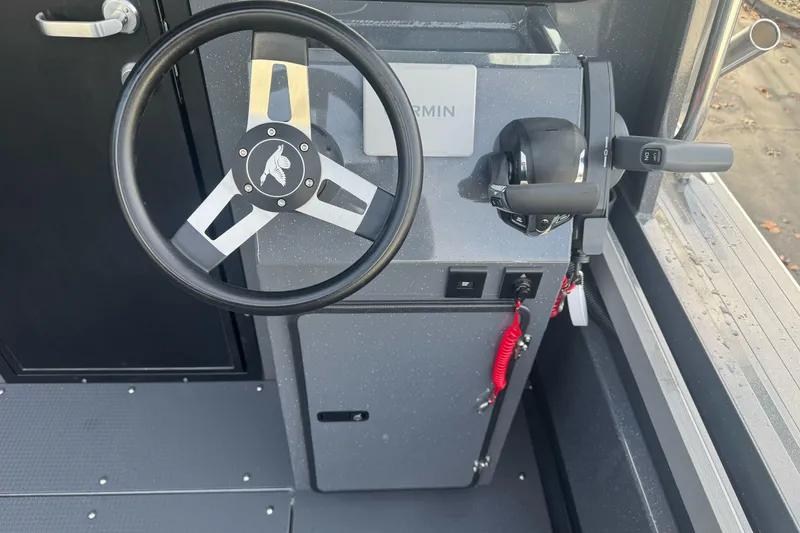 Slide: The Image of Steering console of 2026 Duckworth 24 Pacific Pro boat with Garmin controls. - 12