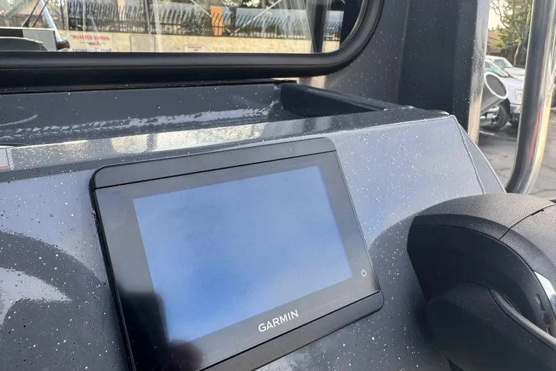 Slide: The Image of Garmin display on 2026 Duckworth 24 Pacific Pro boat dashboard. - 13