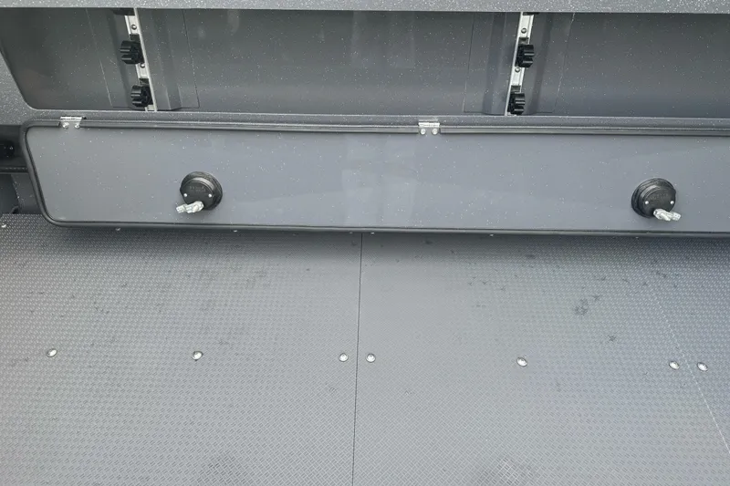 Slide: The Image of Interior view of 2026 Duckworth 24 Pacific Pro boat, showcasing storage compartment. - 18