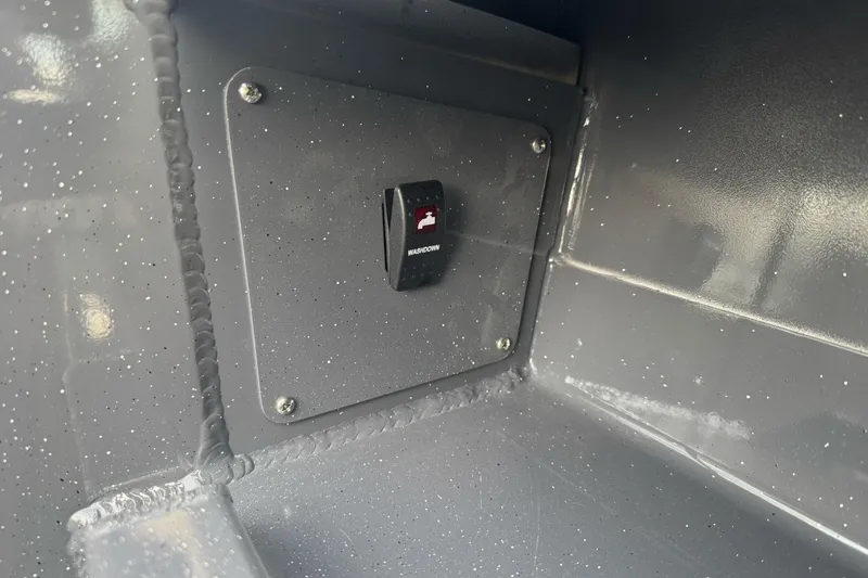 Slide: The Image of Switch panel inside 2026 Duckworth 24 Pacific Pro boat, featuring a washdown button. - 19