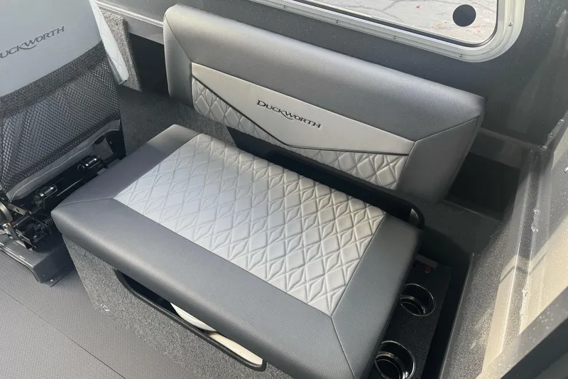 Slide: The Image of 2026 Duckworth 24 Pacific Pro interior seating with quilted design and cup holders. - 24
