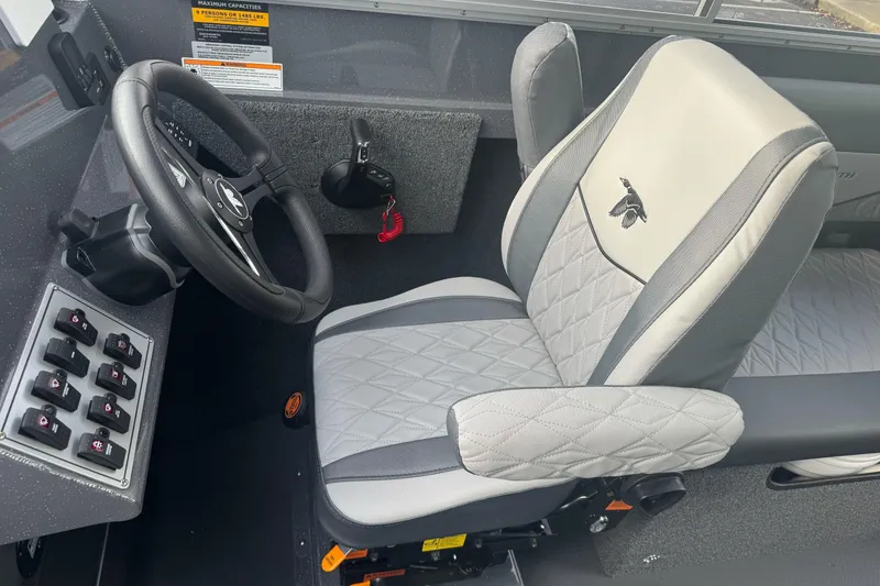 Slide: The Image of Captain's seat and steering wheel of 2026 Duckworth 24 Pacific Pro boat. - 27