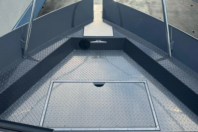 Slide: The Image of Bow area of 2026 Duckworth 24 Pacific Pro boat with diamond plate flooring. - 30
