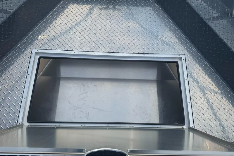 Slide: The Image of Interior view of 2026 Duckworth 24 Pacific Pro boat with diamond plate flooring. - 31