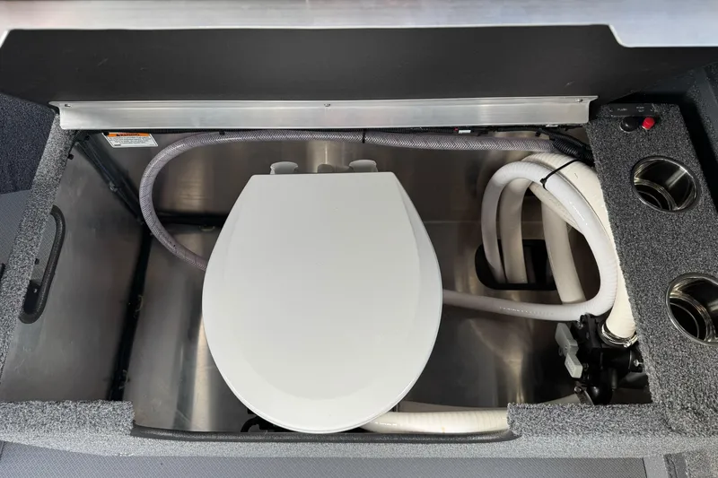 Slide: The Image of 2026 Duckworth 24 Pacific Pro boat interior with built-in toilet and plumbing system. - 37