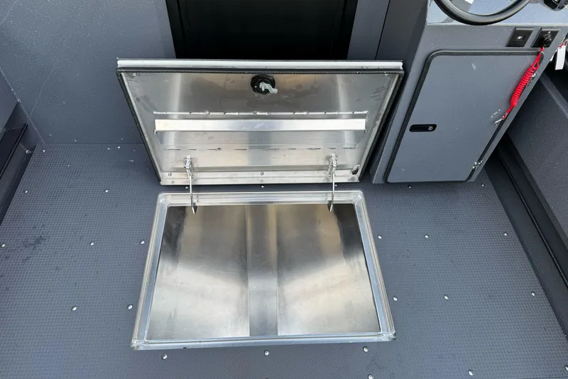 Slide: The Image of Open storage compartment on 2026 Duckworth 24 Pacific Pro boat deck. - 44