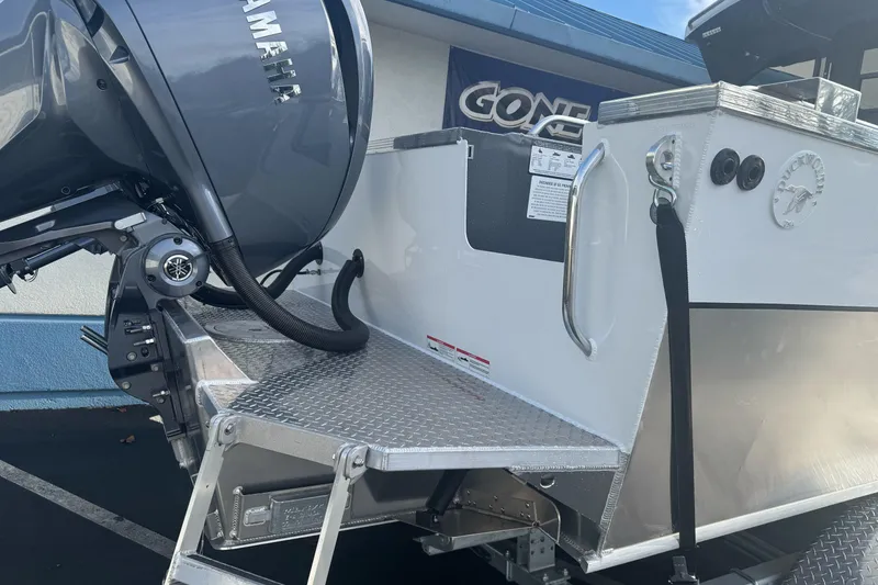 Slide: The Image of 2026 Duckworth 24 Pacific Pro boat with Yamaha outboard motor, rear view. - 6