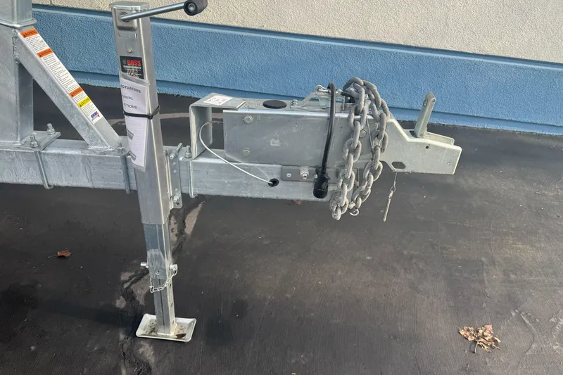 Slide: The Image of Trailer hitch of 2026 Duckworth 24 Pacific Pro with safety chains and jack stand. - 8