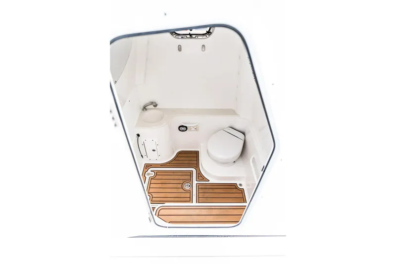 Slide: The Image of 2026 Edgewater 340CC boat interior with modern bathroom and wooden flooring. - 10