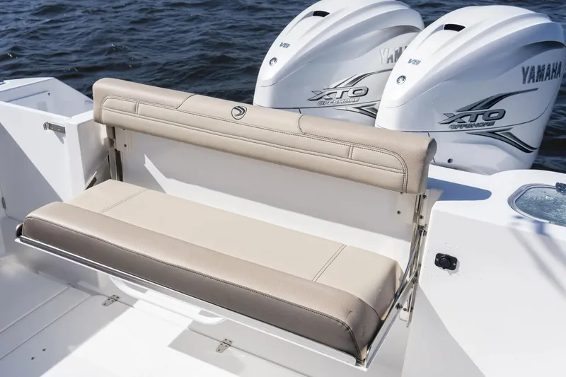 Slide: The Image of 2026 Edgewater 340CC boat with Yamaha XTO engines and beige seating. - 16