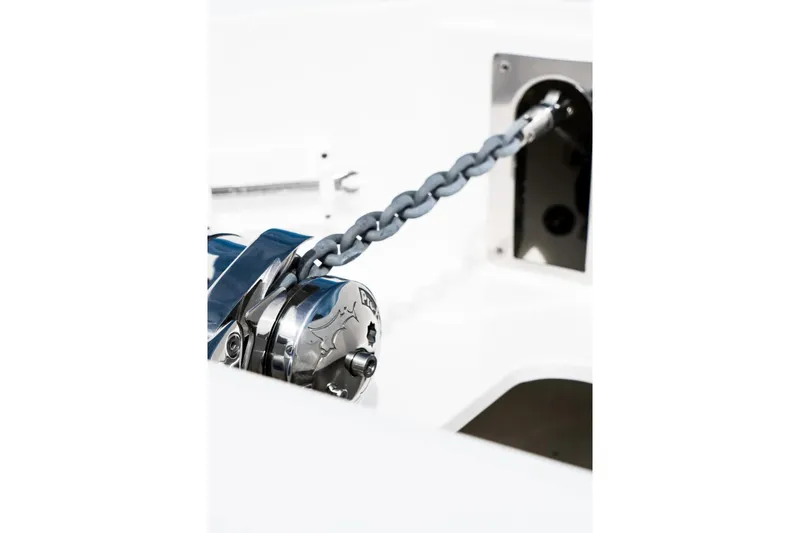 Slide: The Image of Close-up of 2026 Edgewater 340CC boat's anchor chain and winch system. - 21