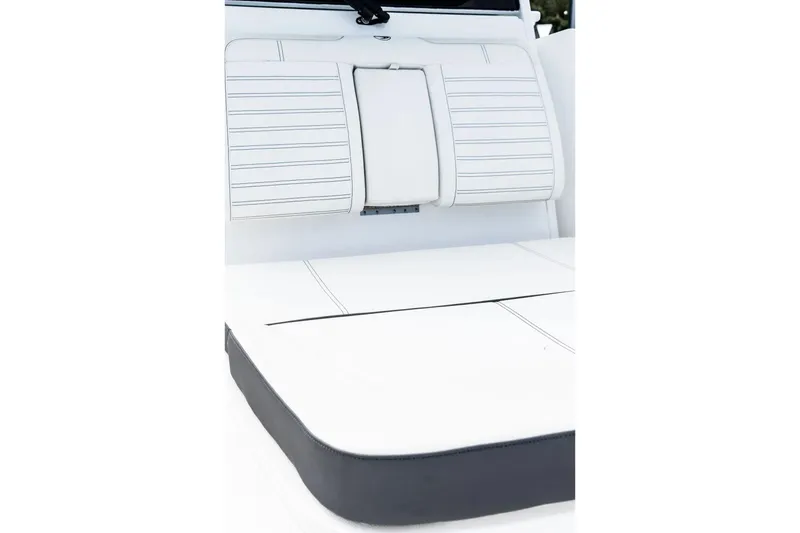 Slide: The Image of 2026 Edgewater 340CC boat interior with white cushioned seating and sleek design. - 25