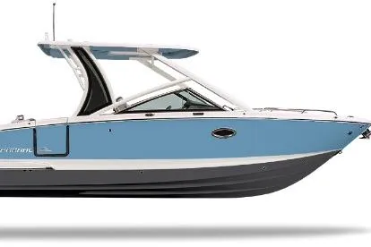 The Image of 2026 Chaparral 280 OSX boat displayed indoors, featuring sleek blue and white design. - 0