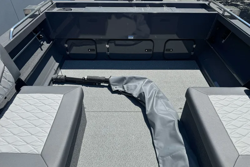 Slide: The Image of Interior of 2026 Duckworth 18 Advantage boat with gray seating and storage compartments. - 20