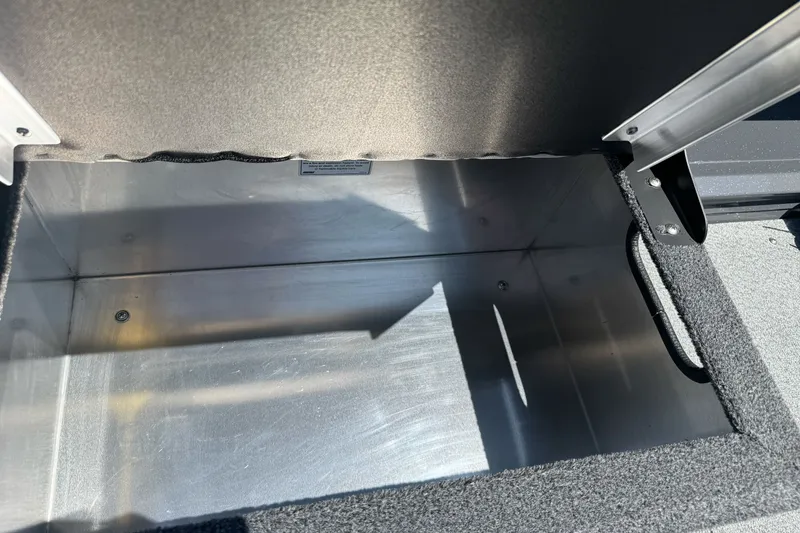 Slide: The Image of Storage compartment of 2026 Duckworth 18 Advantage boat, featuring durable metal interior. - 17