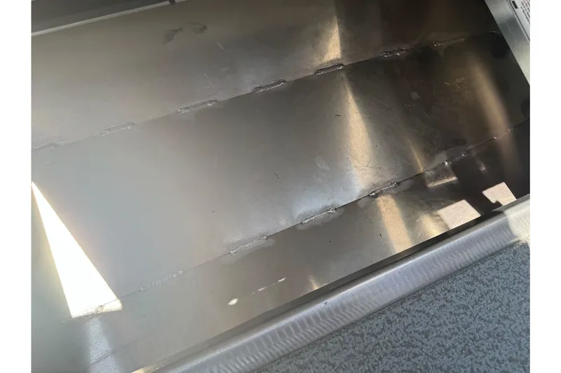 Slide: The Image of Interior view of 2026 Duckworth 18 Advantage boat, showcasing metal flooring. - 21