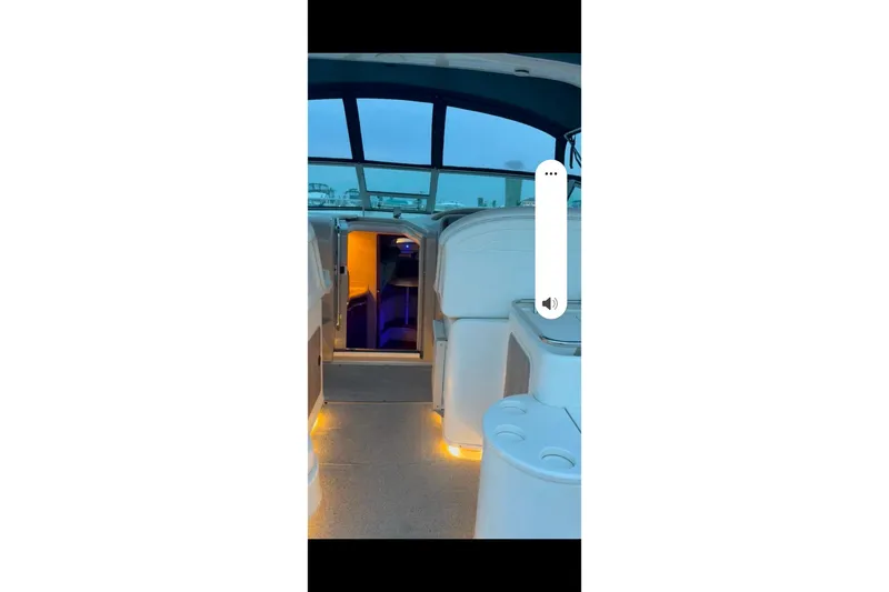 Slide: The Image of 1998 Sea Ray 340 Amberjack helm with Raymarine electronics and steering wheel. - 13