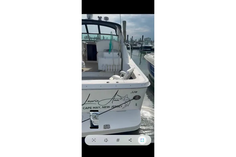Slide: The Image of 1998 Sea Ray 340 Amberjack dashboard with gauges and navigation equipment. - 16
