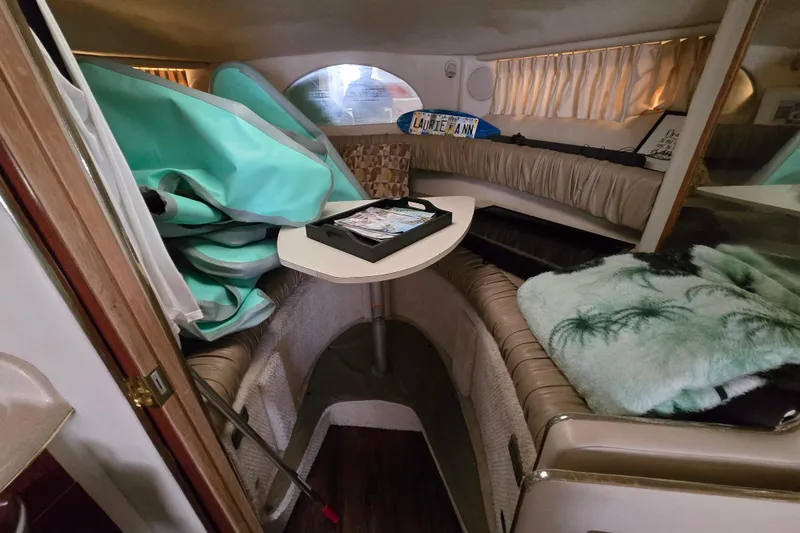 Slide: The Image of Interior of 1998 Sea Ray 340 Amberjack boat with seating and table. - 30