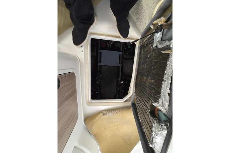 Slide: The Image of 1998 Sea Ray 340 Amberjack engine compartment with open hatch and visible components. - 31