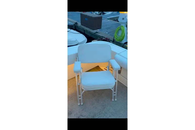 Slide: The Image of White chair on 1998 Sea Ray 340 Amberjack boat deck, dockside view. - 36