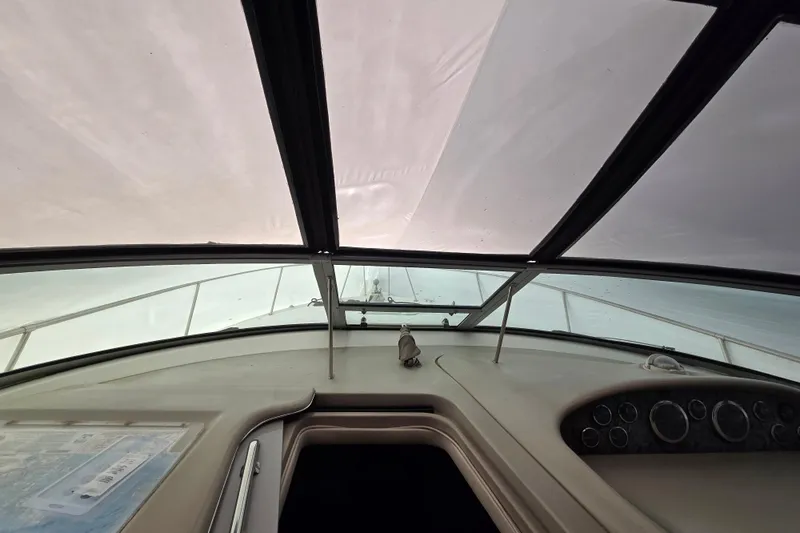 Slide: The Image of Interior view of 1998 Sea Ray 340 Amberjack boat cockpit with dashboard and windshield. - 41